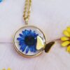 Handcrafted Resin Butterfly Necklace - Gold Toned Flower Inlay