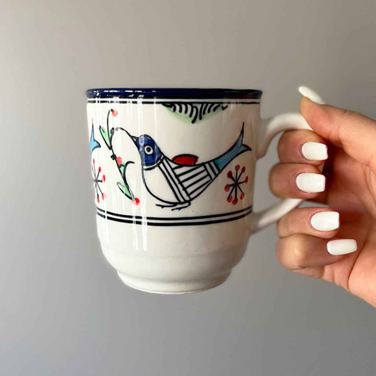 Artistic Ceramic Cup – Handcrafted with White Bird and Flower Painted Design