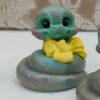 Adorable Snake Figurines with Bows for Nowruz 1404
