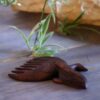 Hand-Carved Wooden Comb with Intricate Whale Design