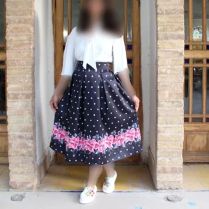 Black Pleated Satin Skirt with White Polka Dots and Bold Pink Floral Hem