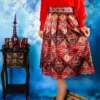 Pleated-Midi-Satin-Skirt-with-Red-Persian-Kilim-Motifs-and-Tribal-Geometry-2